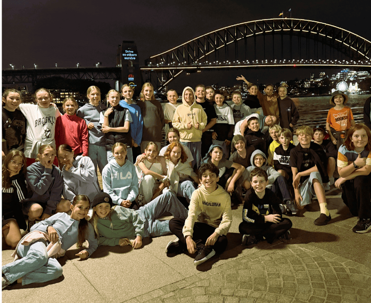 Photo of year 6 student in front of the Sydney Harbour Bridge.